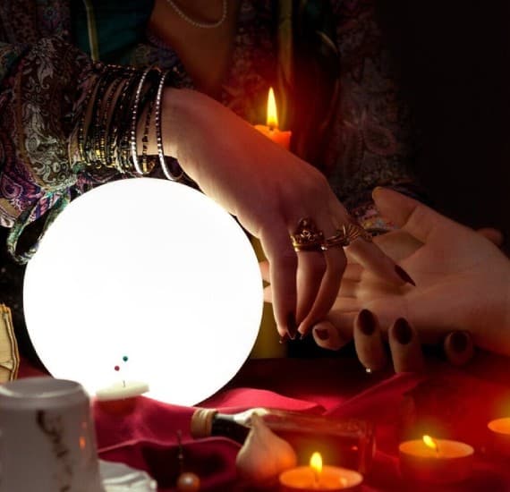Astrologer reading natal chart